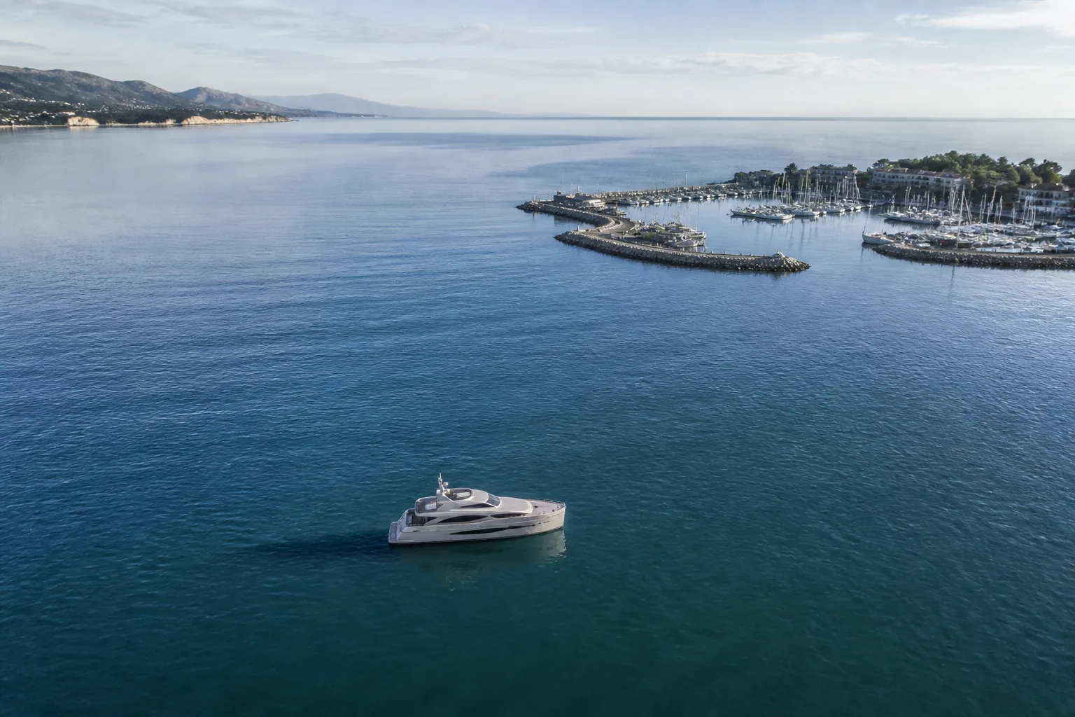 Quiet aerial coastline with marina and yacht