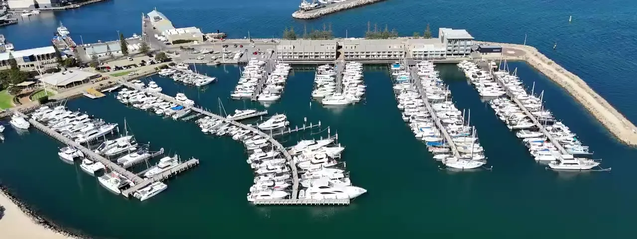 Aerial view of a marina, entrance, docks and berths