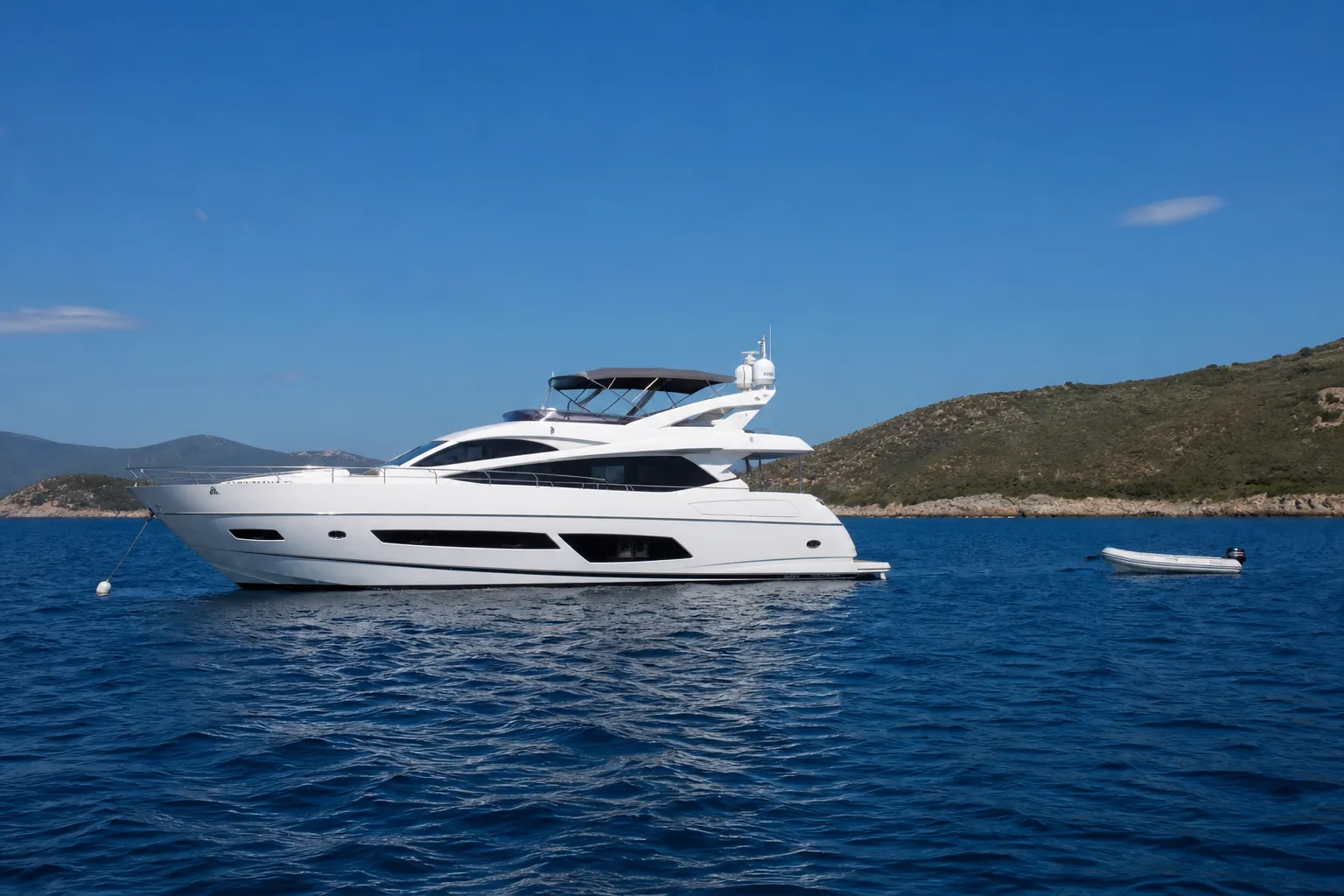 Motor yacht at anchor in open coastal water