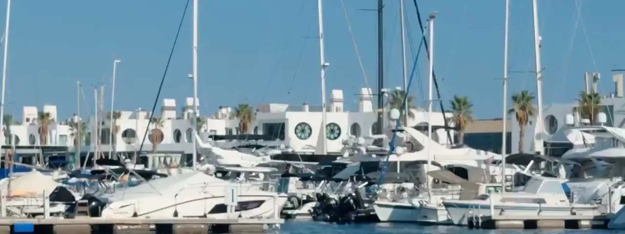 Luxury motor yachts berthed in a marina
